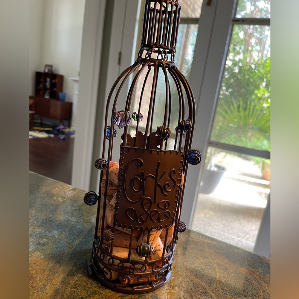 Wine cork holder. Looks great in bar. Opens from bottom.